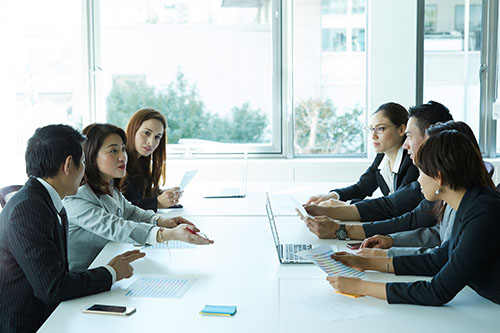 Several men and women having a business meeting