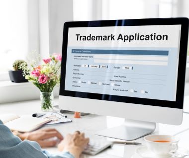 a photo of applying trademark through computer.