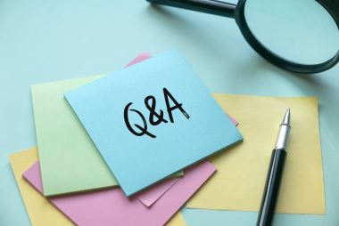 A multi color empty sticky paper note written with Q&A or questions and answers.