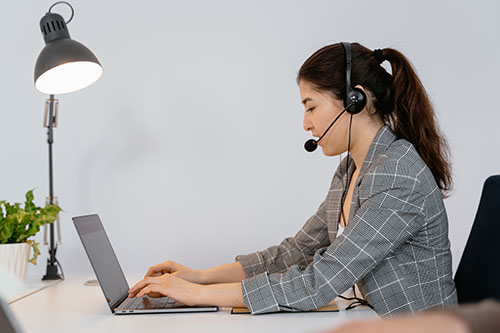 A woman performing secretarial and customer service